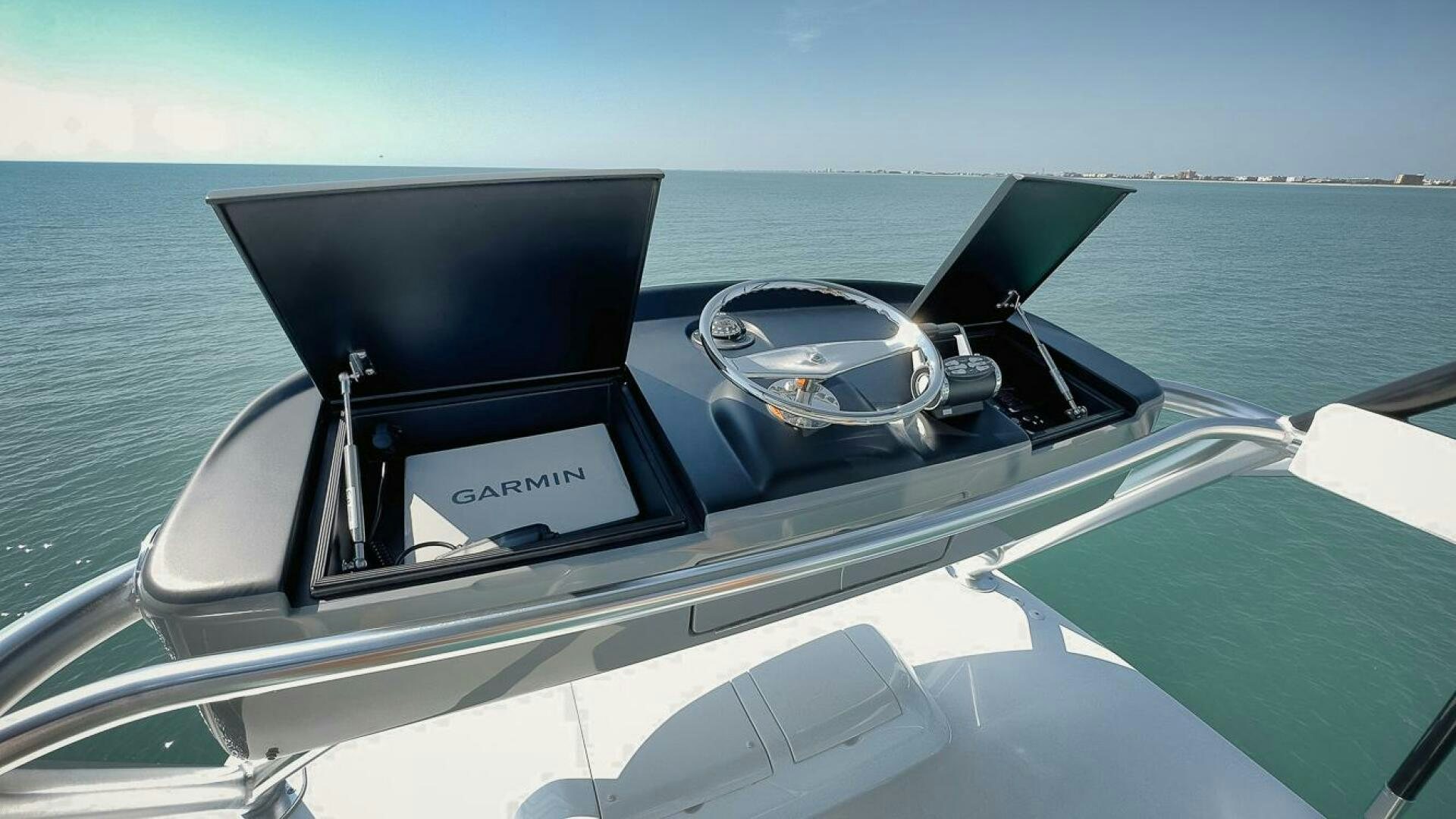 a white boat with a steering wheel aboard WHIRLWIND Yacht for Sale