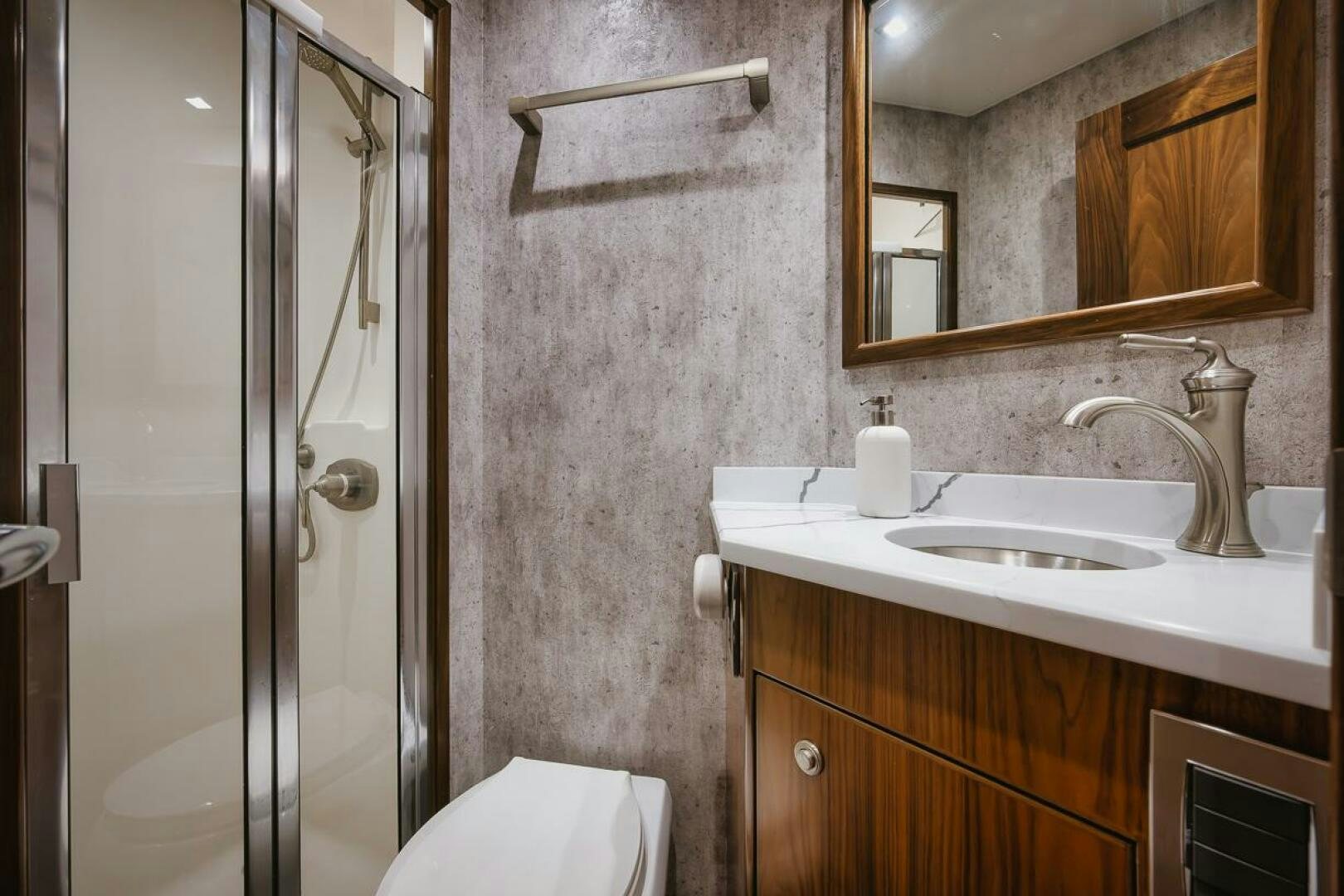 a bathroom with a sink and a shower aboard WHIRLWIND Yacht for Sale