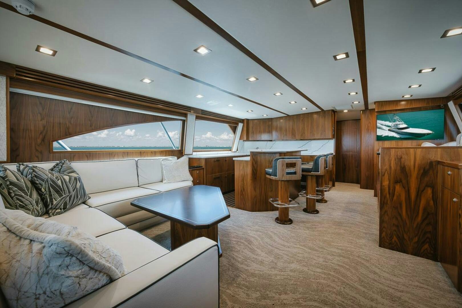 a room with a couch and a table aboard WHIRLWIND Yacht for Sale