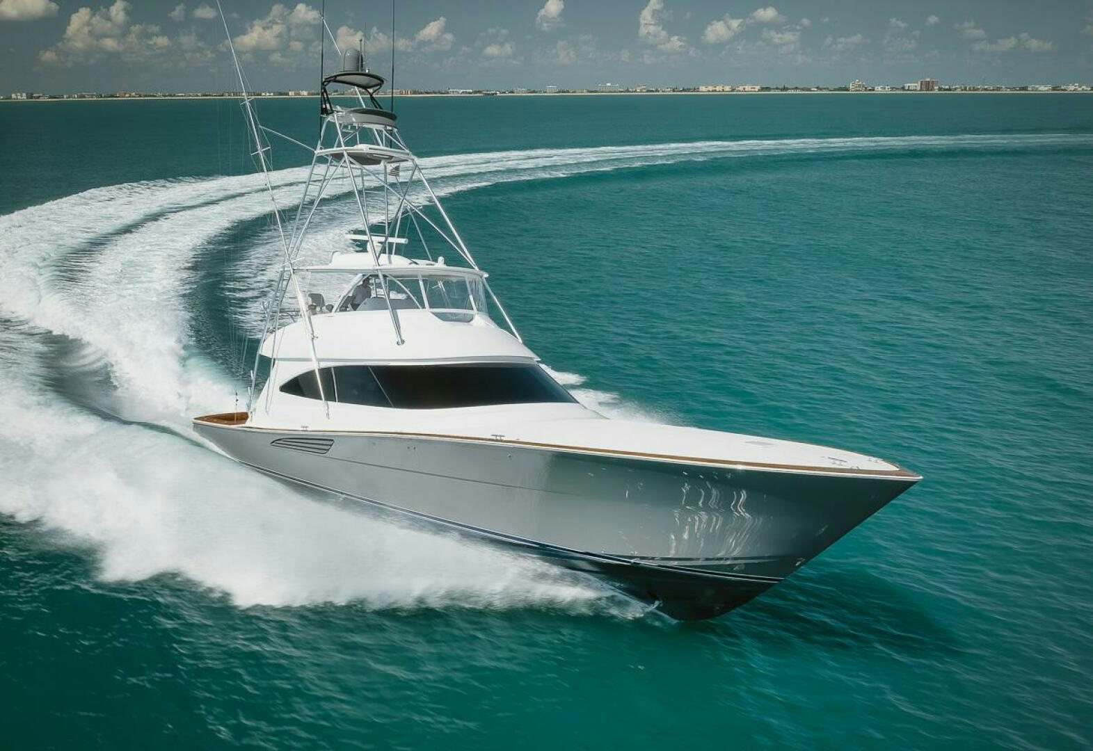 a white boat on the water aboard WHIRLWIND Yacht for Sale