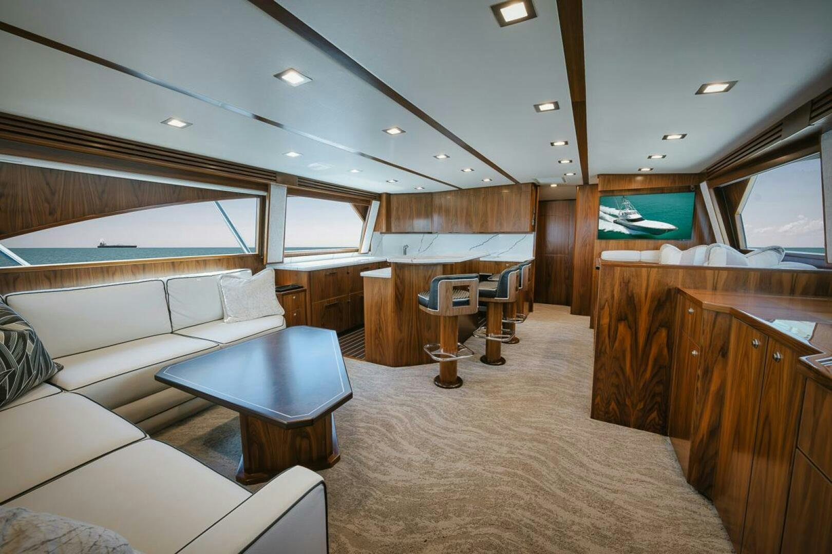 a room with a couch and a table aboard WHIRLWIND Yacht for Sale