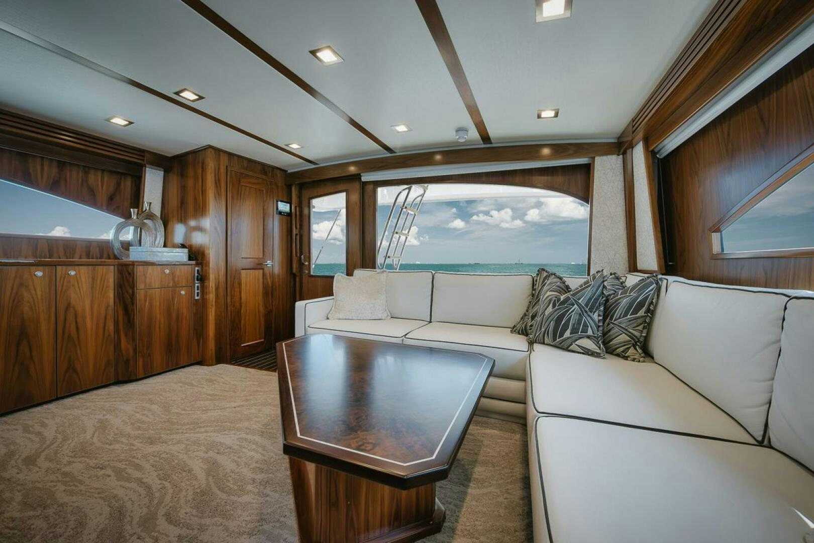 a living room with a large window aboard WHIRLWIND Yacht for Sale