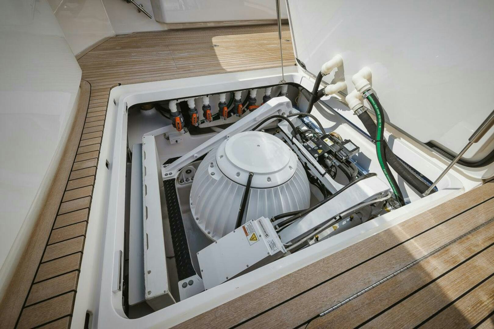 a white machine with a black circle aboard WHIRLWIND Yacht for Sale
