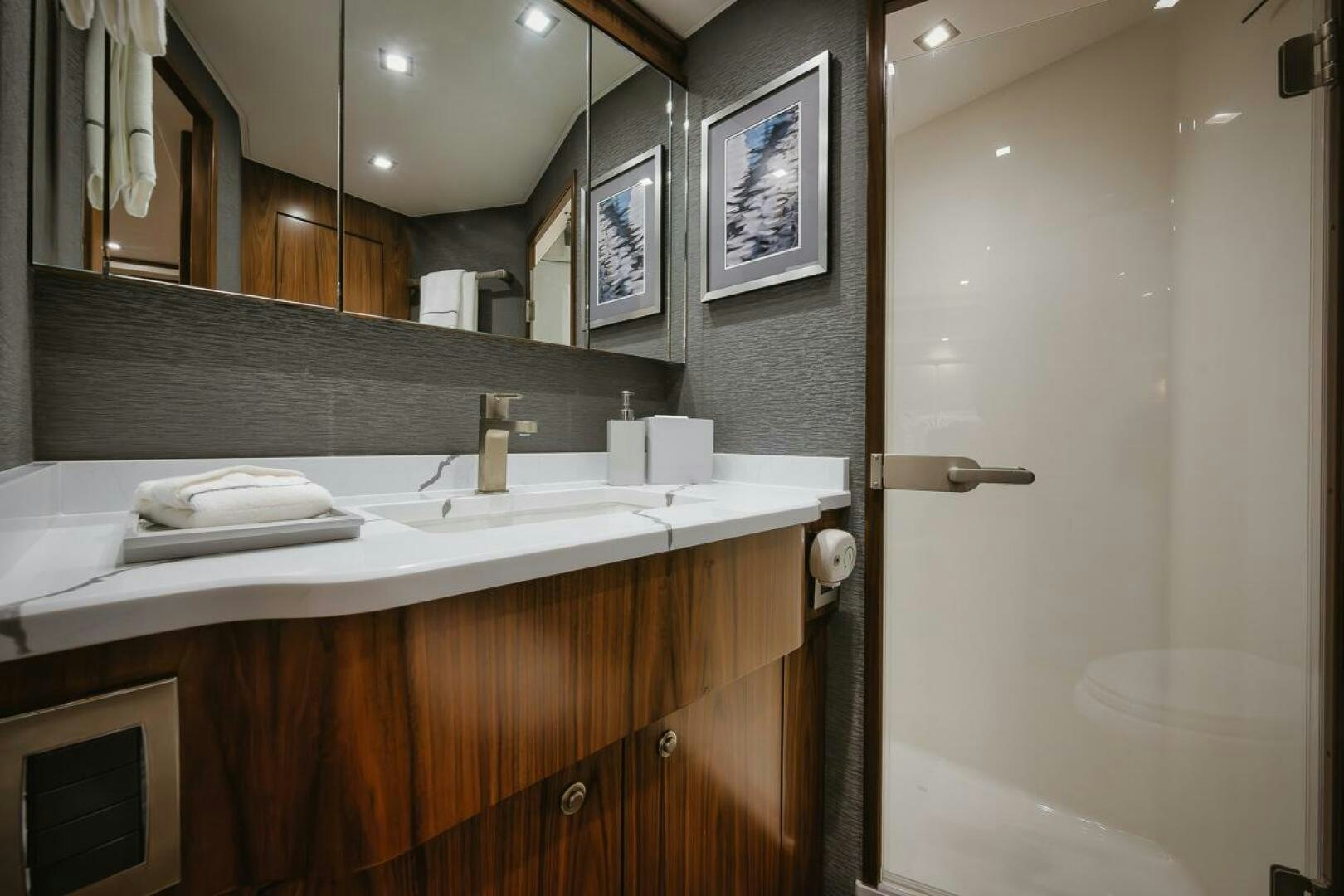 a bathroom with a sink and a mirror aboard WHIRLWIND Yacht for Sale