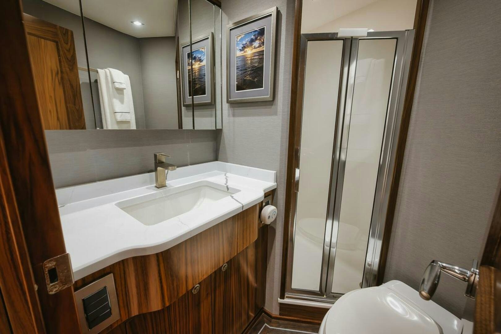 a bathroom with a standup shower aboard WHIRLWIND Yacht for Sale