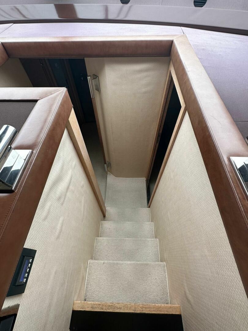 a staircase with a rectangular object on the side aboard SEVEN Yacht for Sale