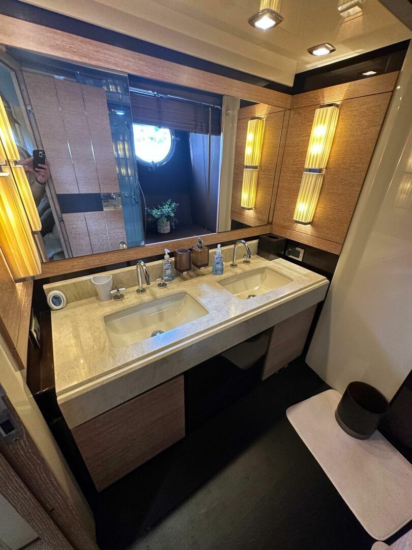 a bathroom with a large mirror aboard SEVEN Yacht for Sale