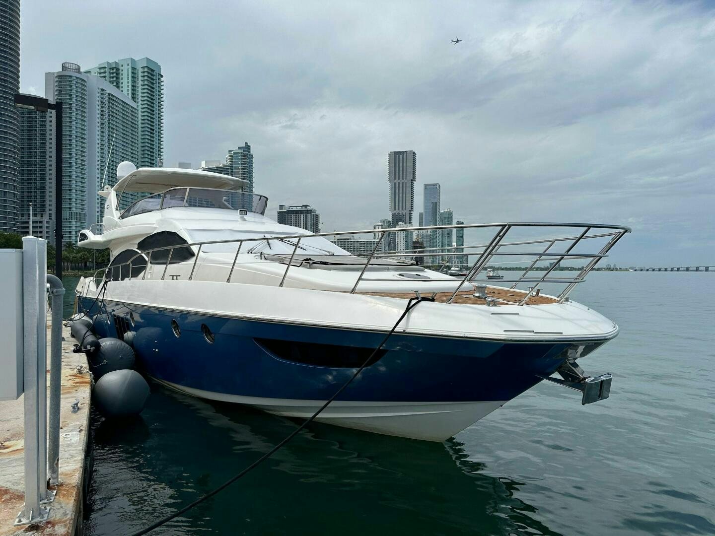a boat docked at a pier aboard SEVEN Yacht for Sale
