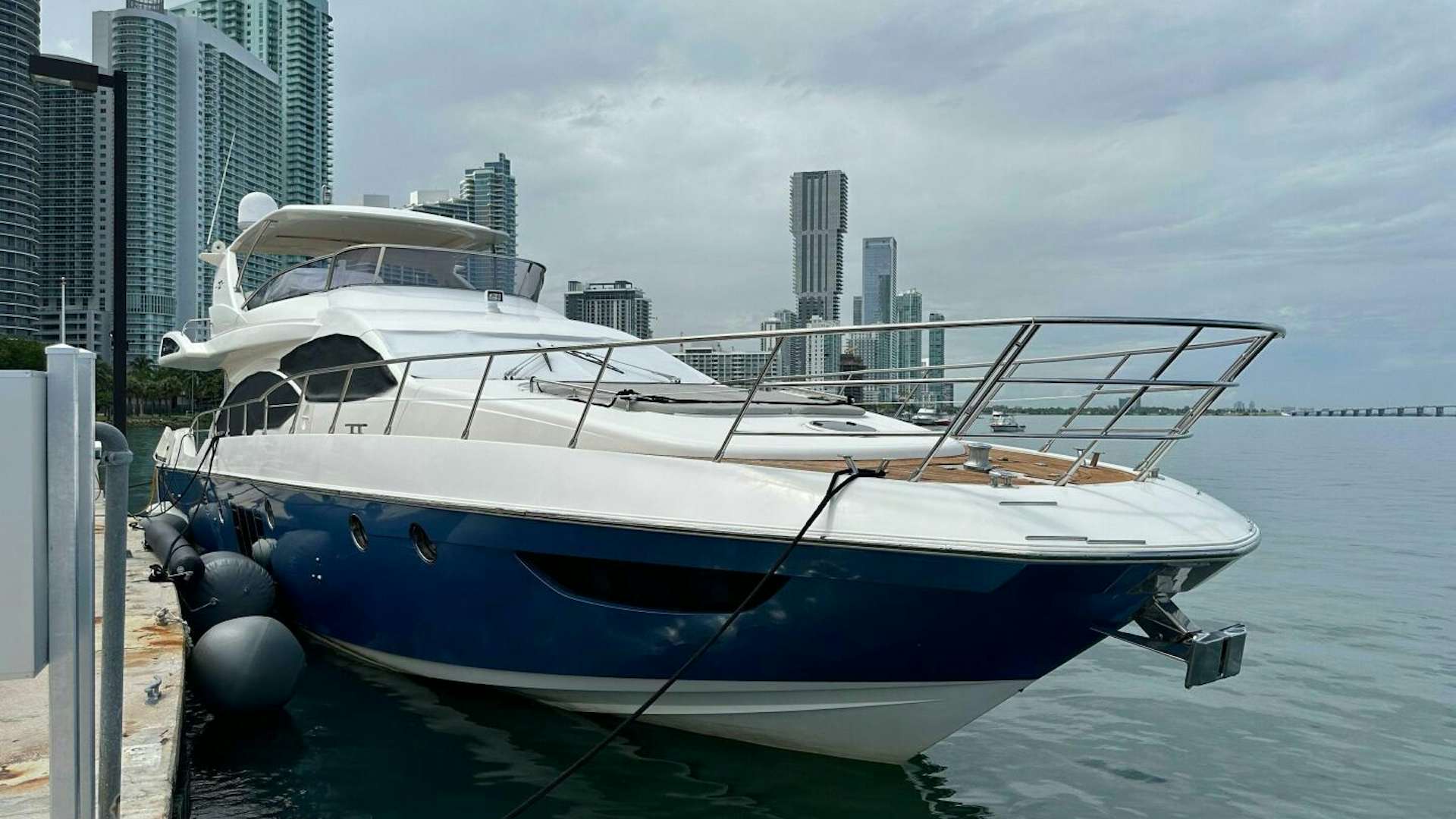 a boat docked at a pier aboard SEVEN Yacht for Sale