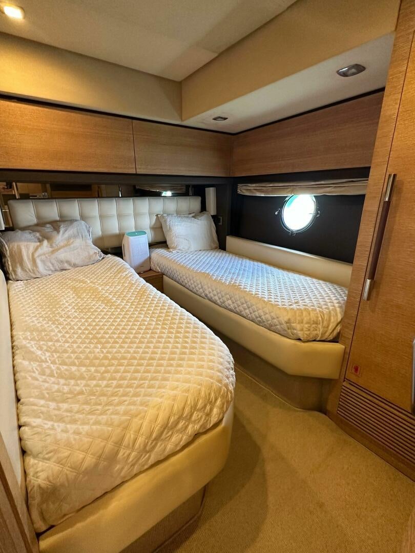a room with two beds aboard SEVEN Yacht for Sale