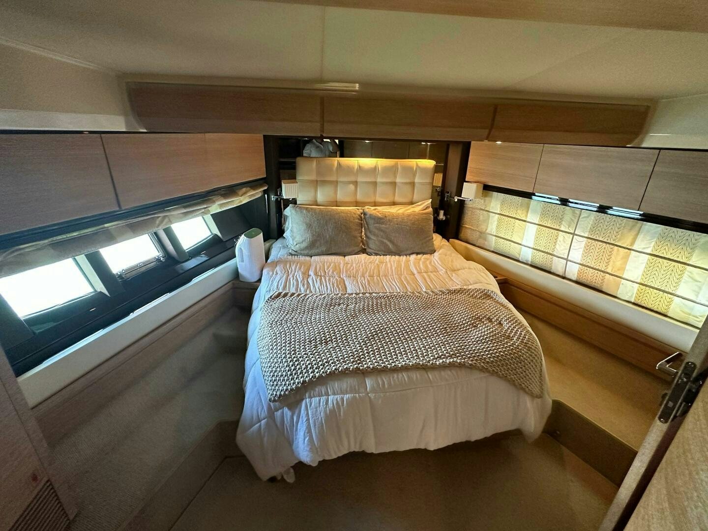 a room with a bed and a window aboard SEVEN Yacht for Sale