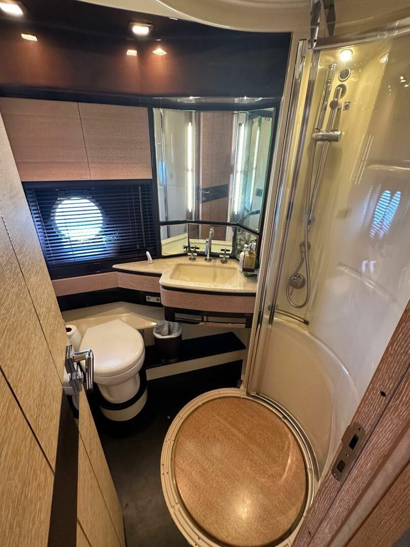 a bathroom with a toilet and sink aboard SEVEN Yacht for Sale