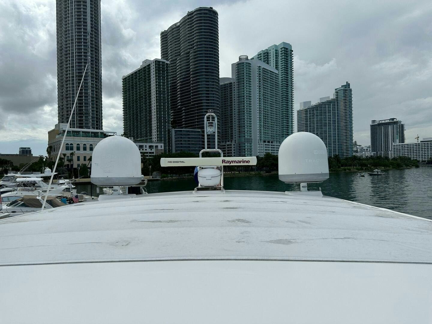 a large white building with a dome and a white dome in front of a city aboard SEVEN Yacht for Sale
