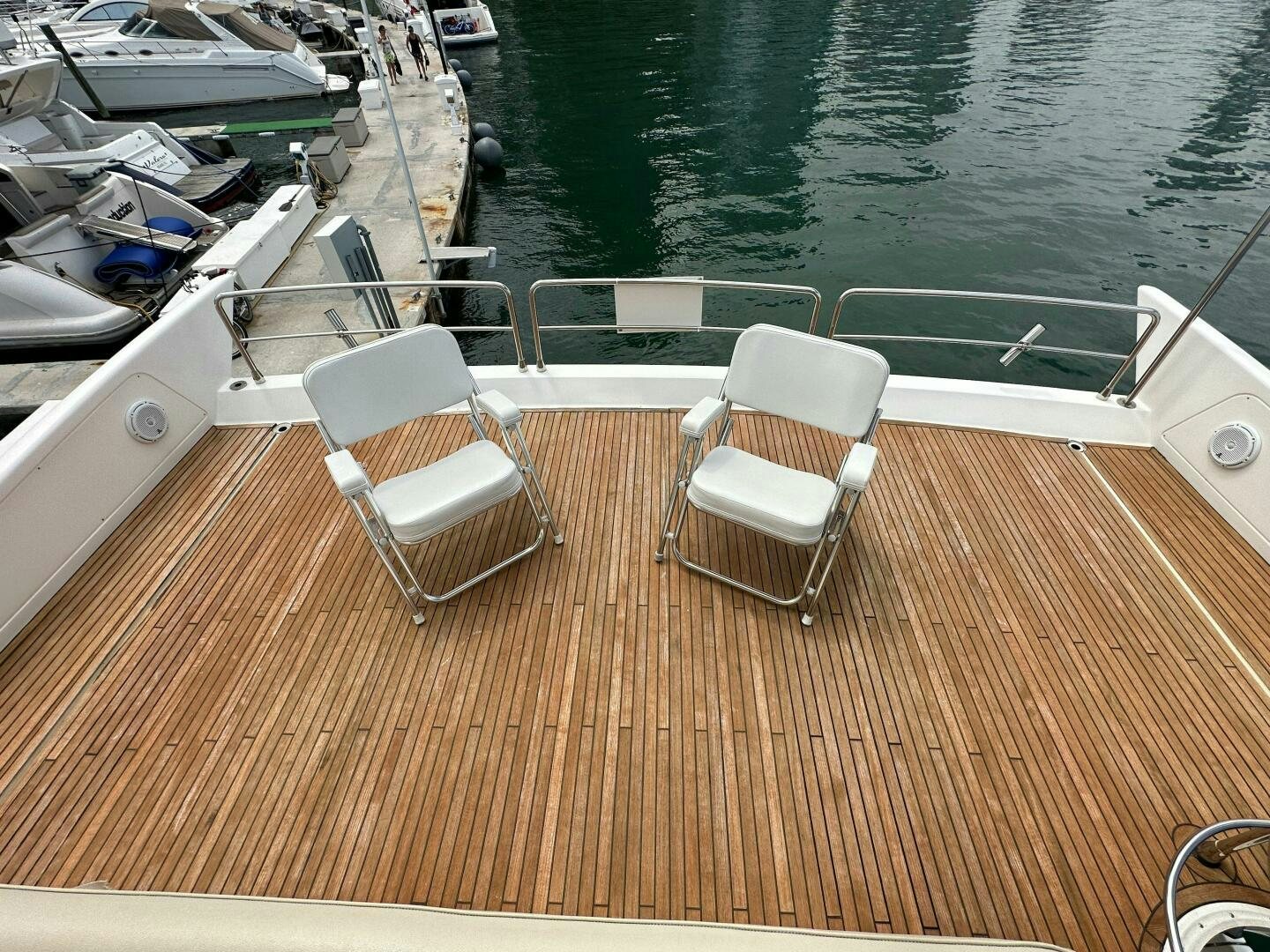 a deck with chairs on it aboard SEVEN Yacht for Sale