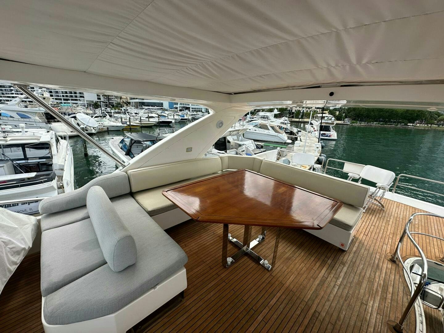 a table on a deck overlooking a body of water aboard SEVEN Yacht for Sale