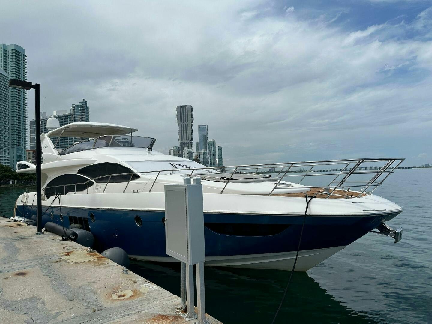 a boat docked at a pier aboard SEVEN Yacht for Sale