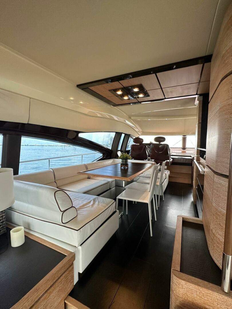 a room with a couch and a table aboard SEVEN Yacht for Sale