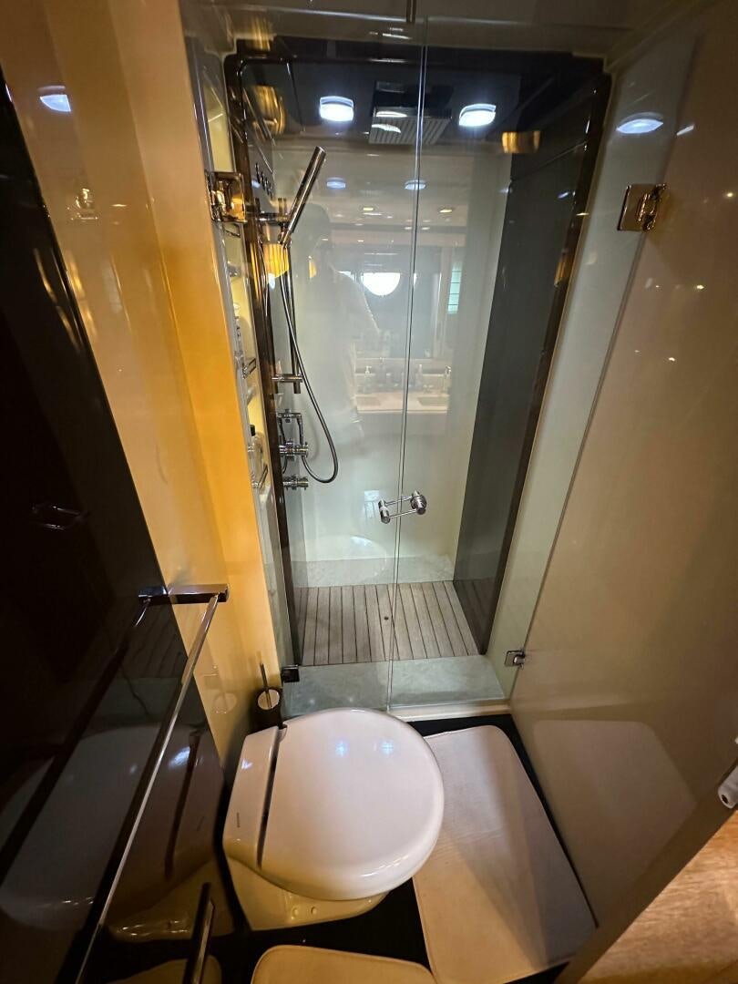 a bathroom with a glass shower aboard SEVEN Yacht for Sale