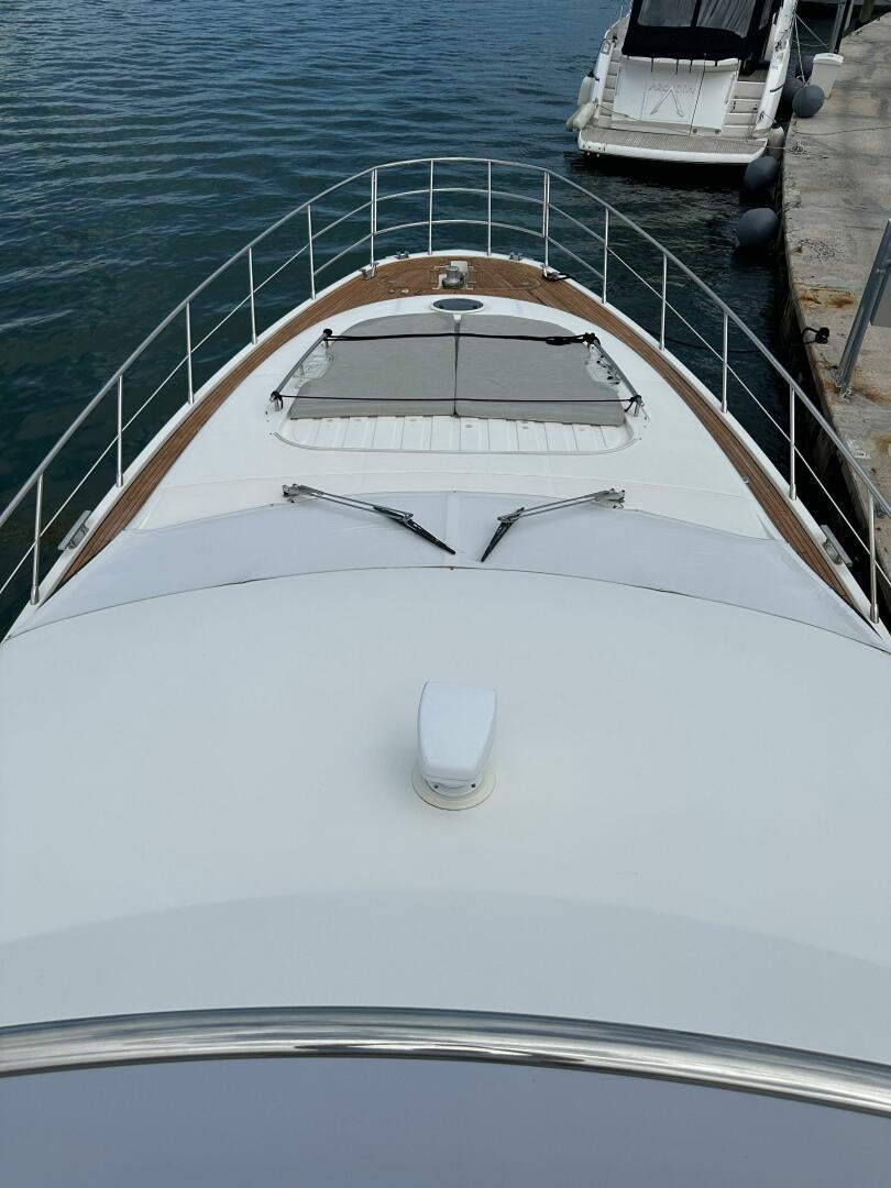 a white boat on a body of water aboard SEVEN Yacht for Sale
