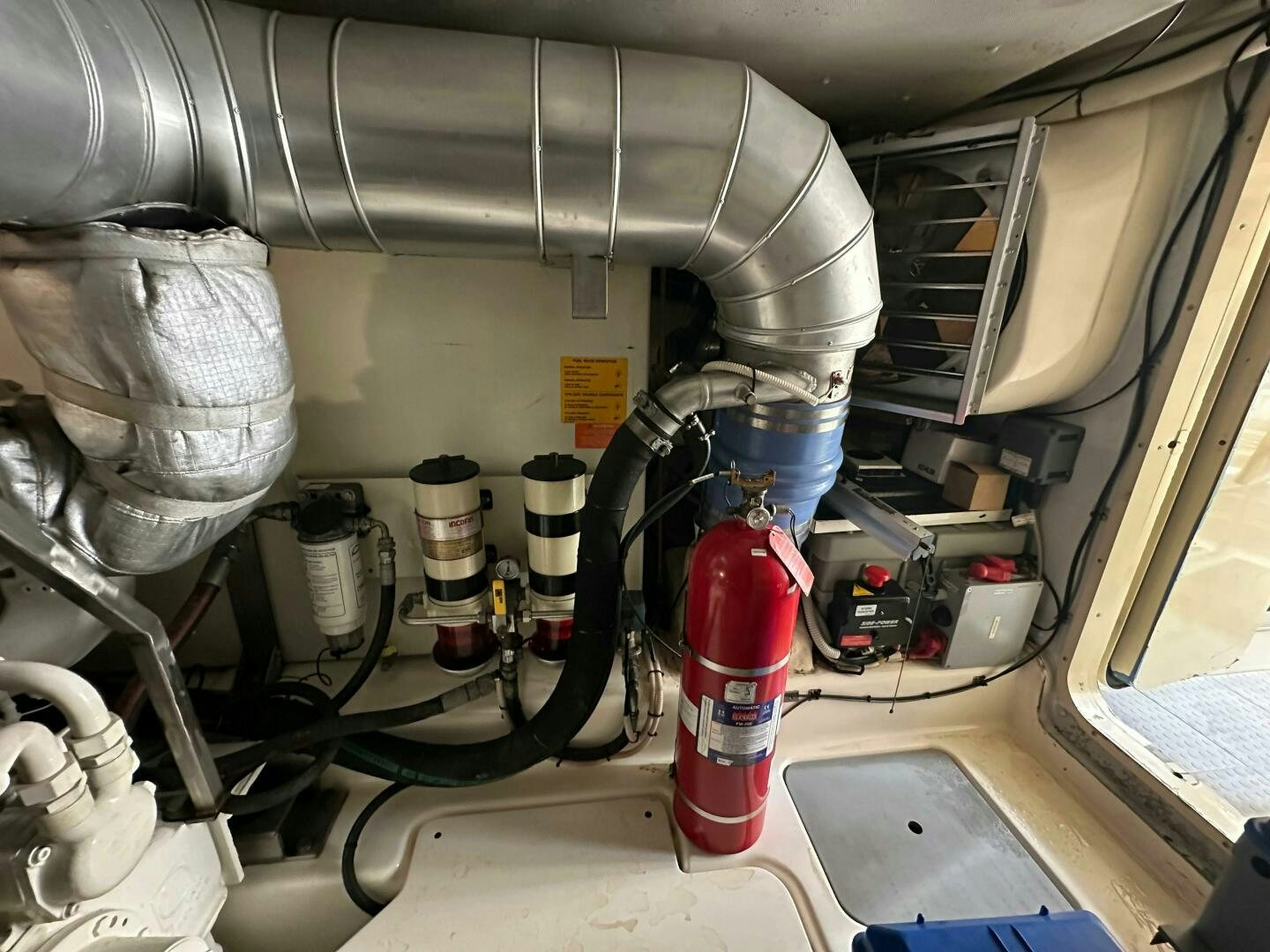 a machine with a red and white cylinder aboard SEVEN Yacht for Sale