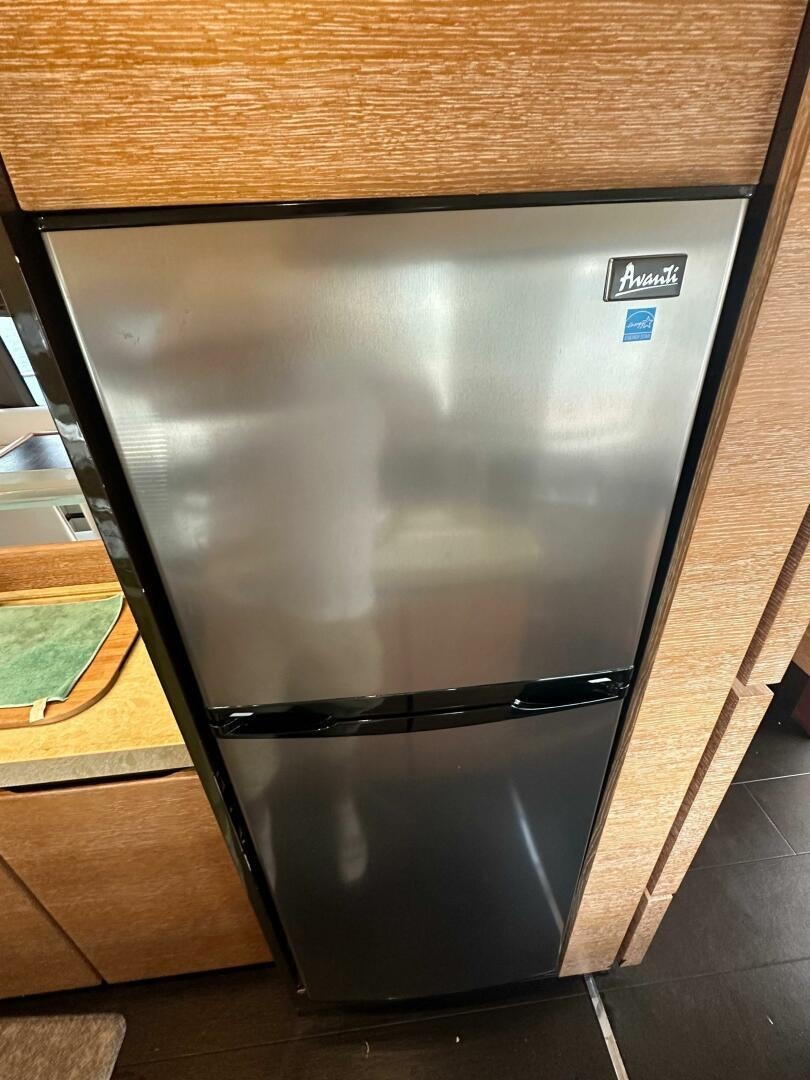 a black rectangular object with a silver frame aboard SEVEN Yacht for Sale