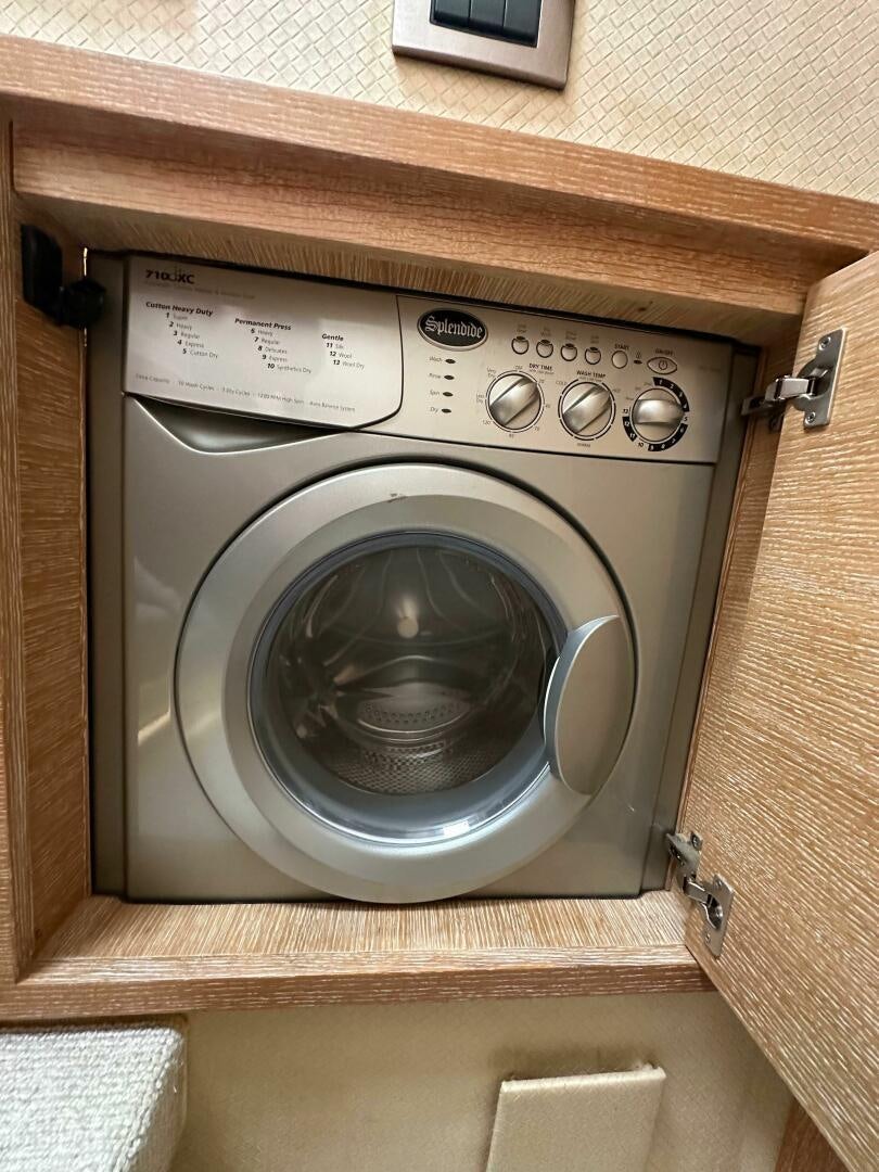 a white washing machine aboard SEVEN Yacht for Sale