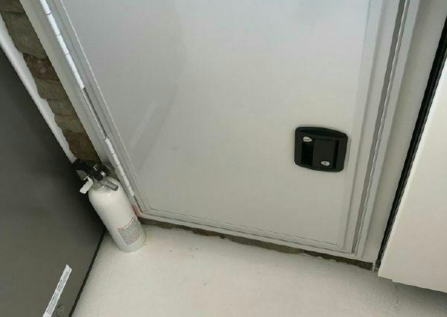 a white wall with a black speaker aboard ST. SOMEWHERE Yacht for Sale