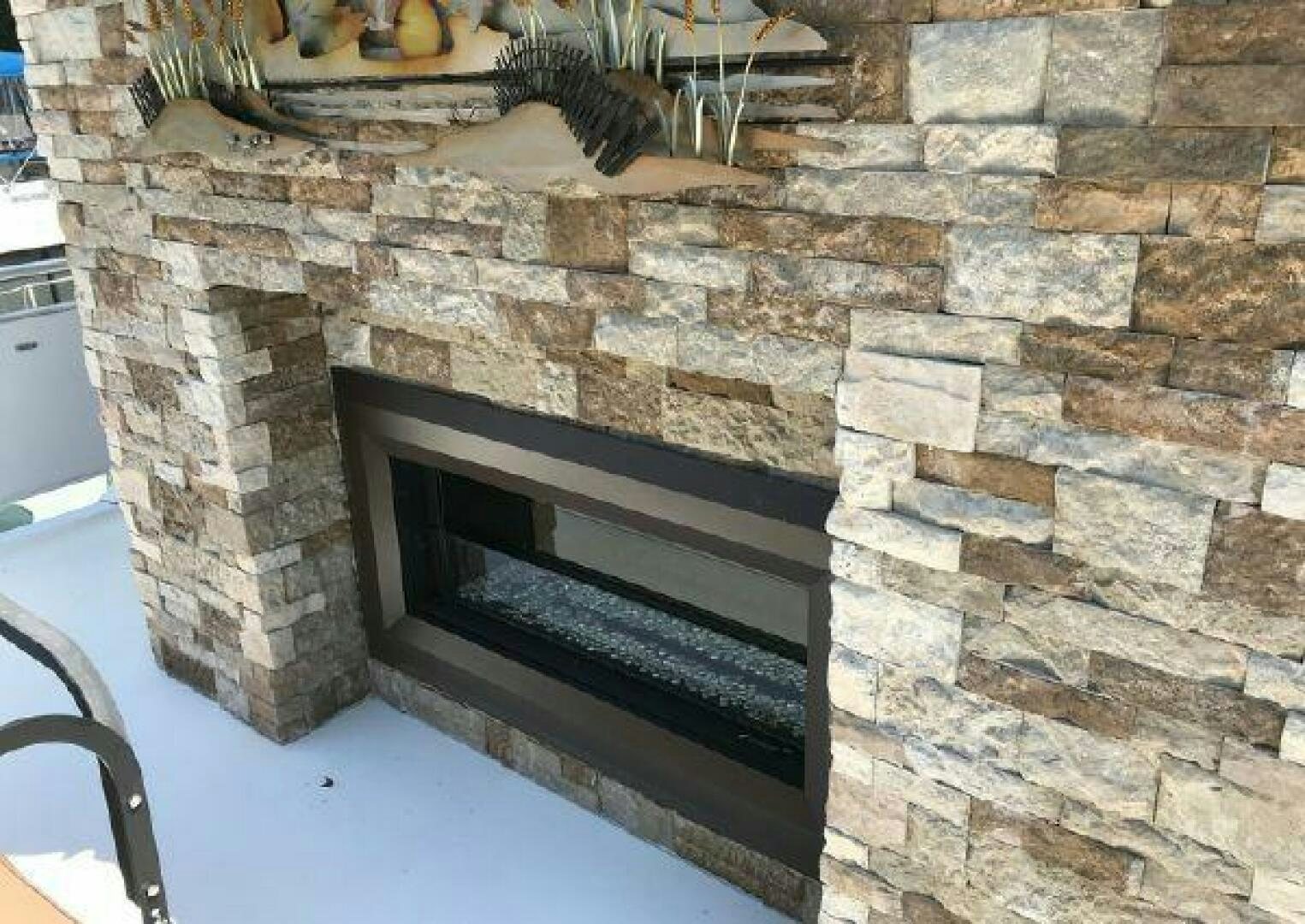 a fireplace in a brick wall aboard ST. SOMEWHERE Yacht for Sale