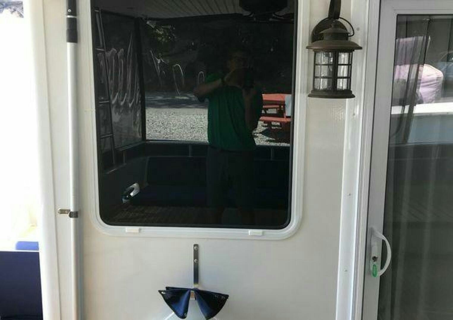 a person standing in a doorway aboard ST. SOMEWHERE Yacht for Sale