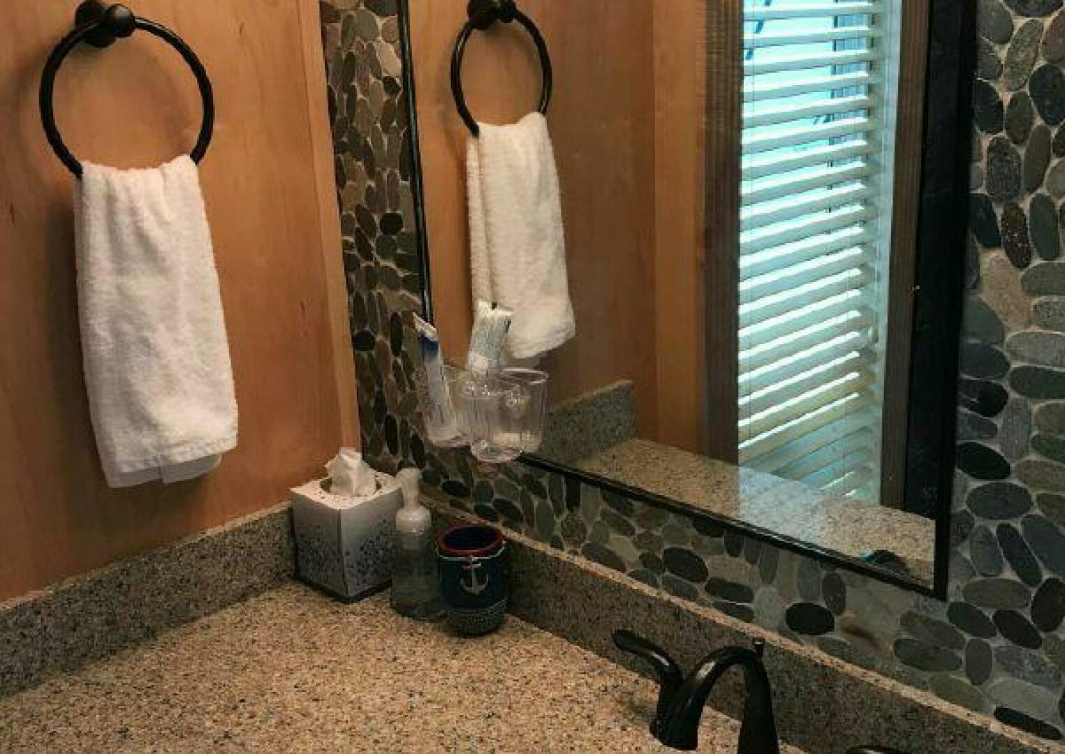 a bathroom with a large mirror aboard ST. SOMEWHERE Yacht for Sale