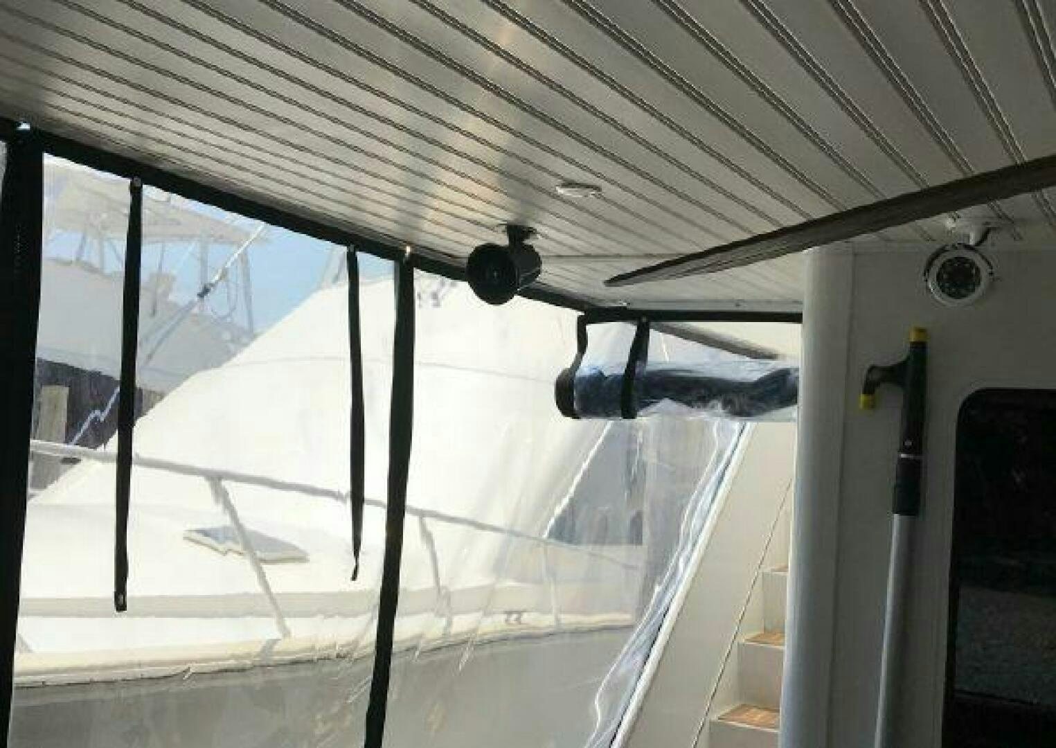 a pair of sunglasses on a glass table aboard ST. SOMEWHERE Yacht for Sale