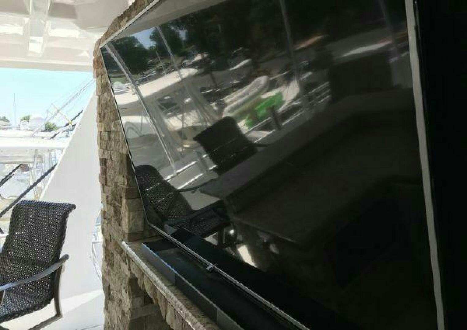 a window with a view of a city street and a chair aboard ST. SOMEWHERE Yacht for Sale