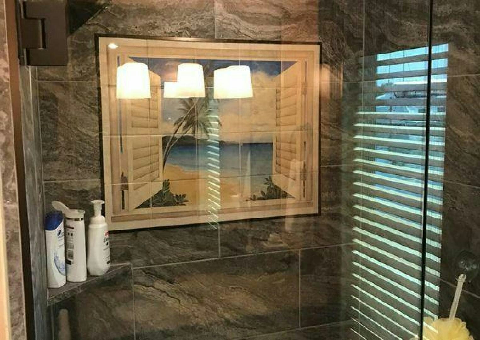 a bathroom with a glass shower aboard ST. SOMEWHERE Yacht for Sale