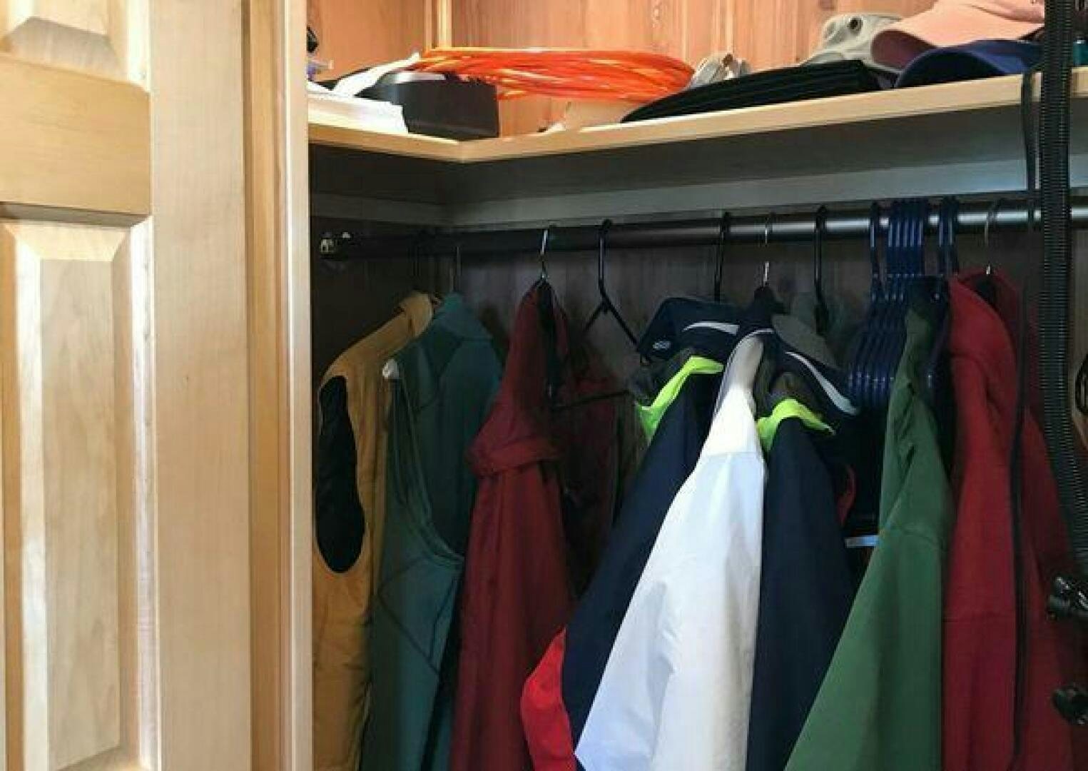 clothes in a closet aboard ST. SOMEWHERE Yacht for Sale