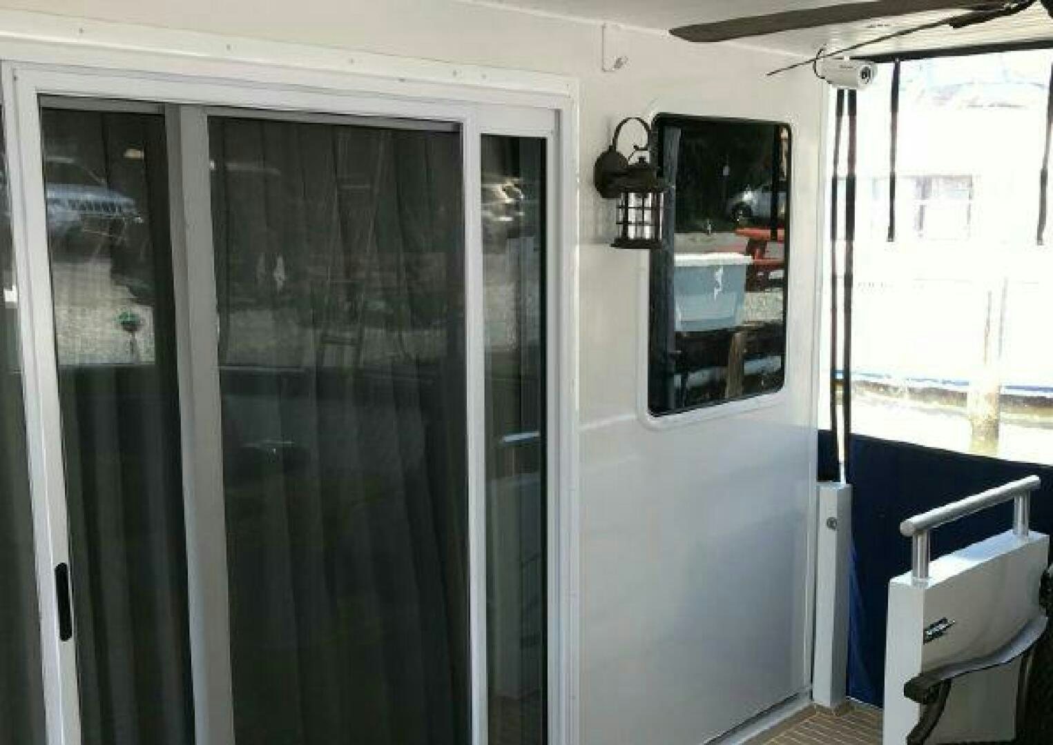 a room with glass doors aboard ST. SOMEWHERE Yacht for Sale