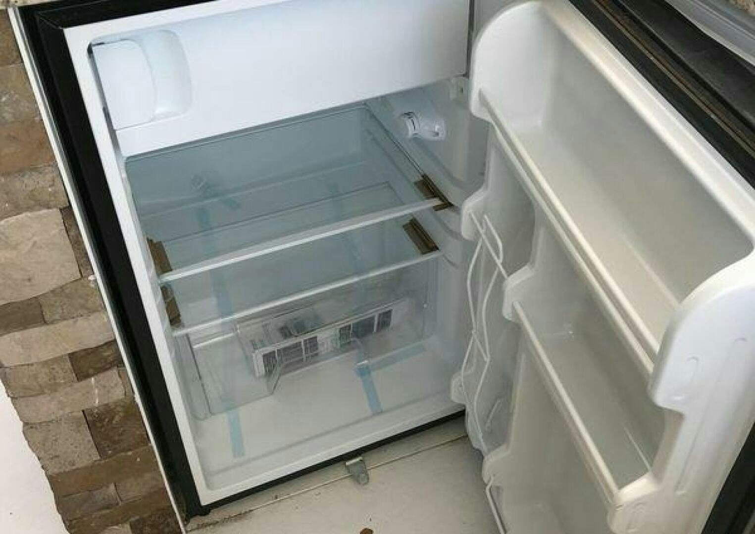 a refrigerator is open aboard ST. SOMEWHERE Yacht for Sale