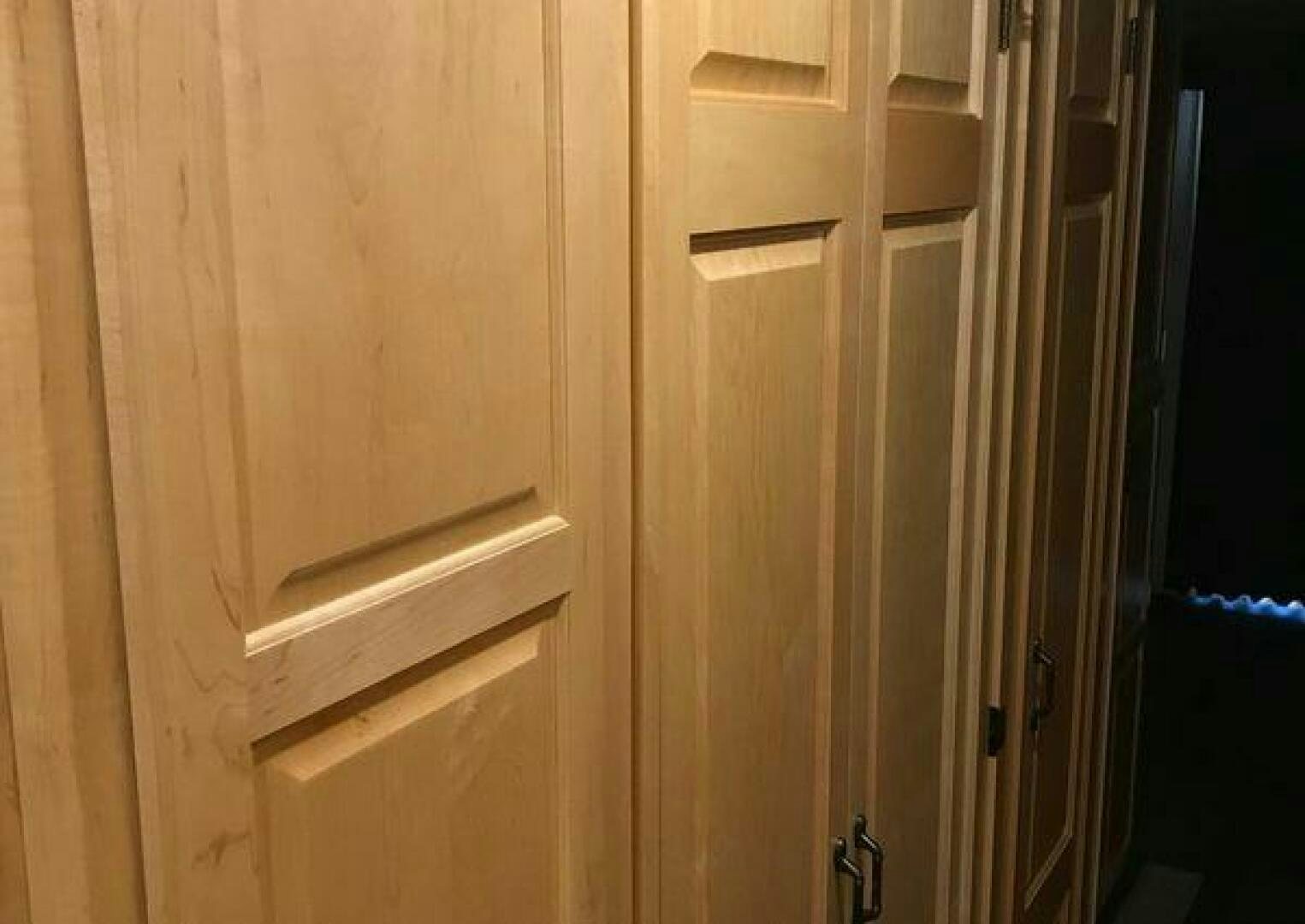 a wooden door with a handle aboard ST. SOMEWHERE Yacht for Sale