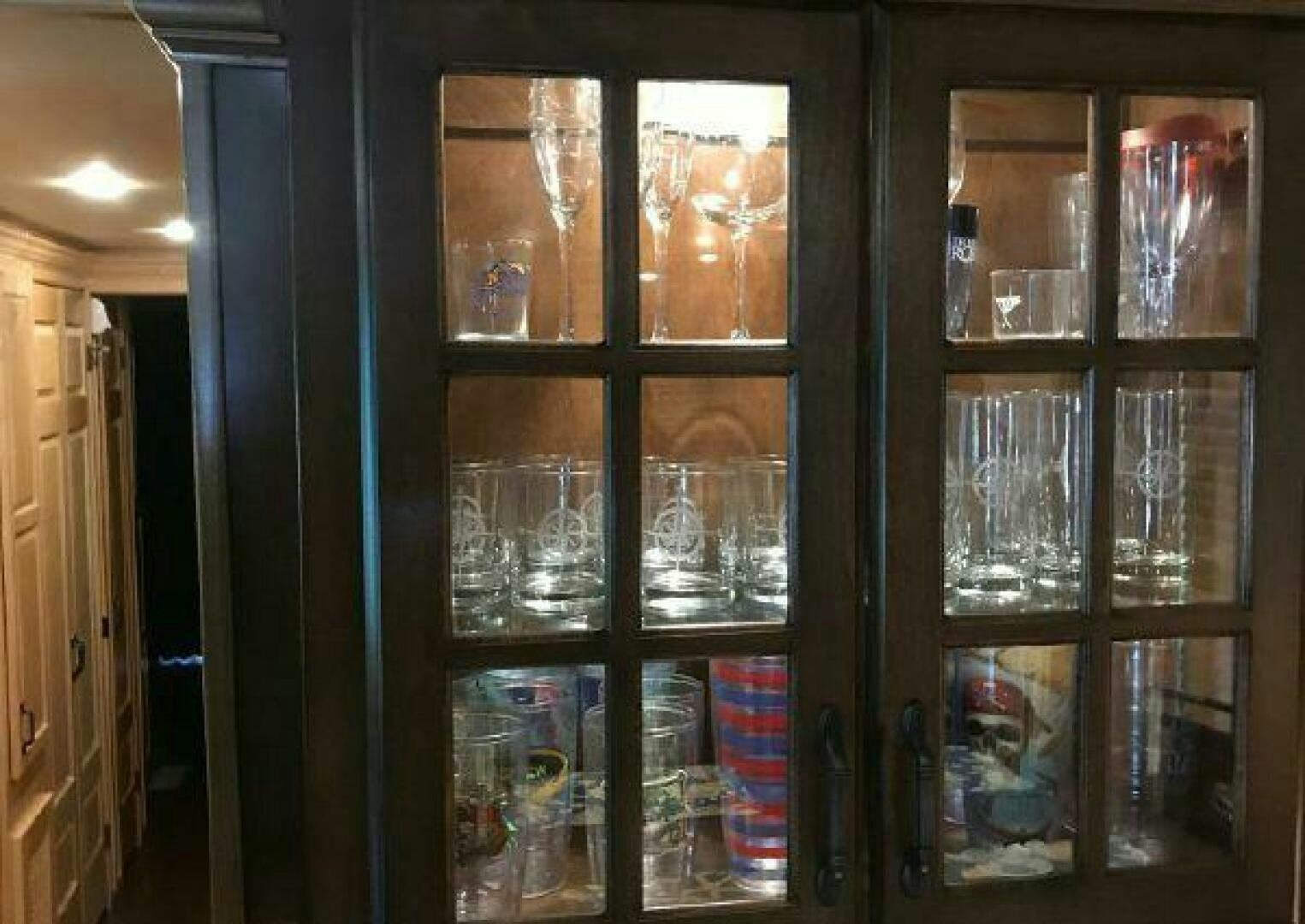 a shelf with glasses and containers aboard ST. SOMEWHERE Yacht for Sale