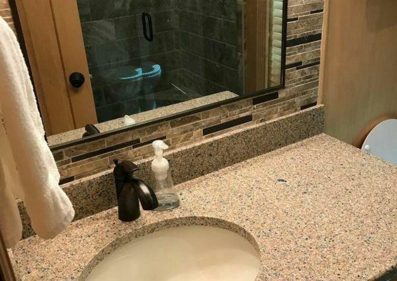a bathroom with a sink and a mirror aboard ST. SOMEWHERE Yacht for Sale