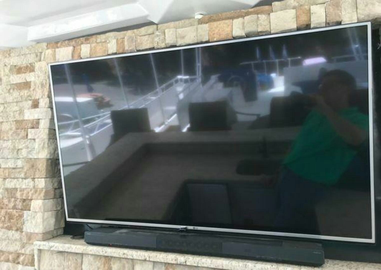 a person standing in front of a brick wall aboard ST. SOMEWHERE Yacht for Sale