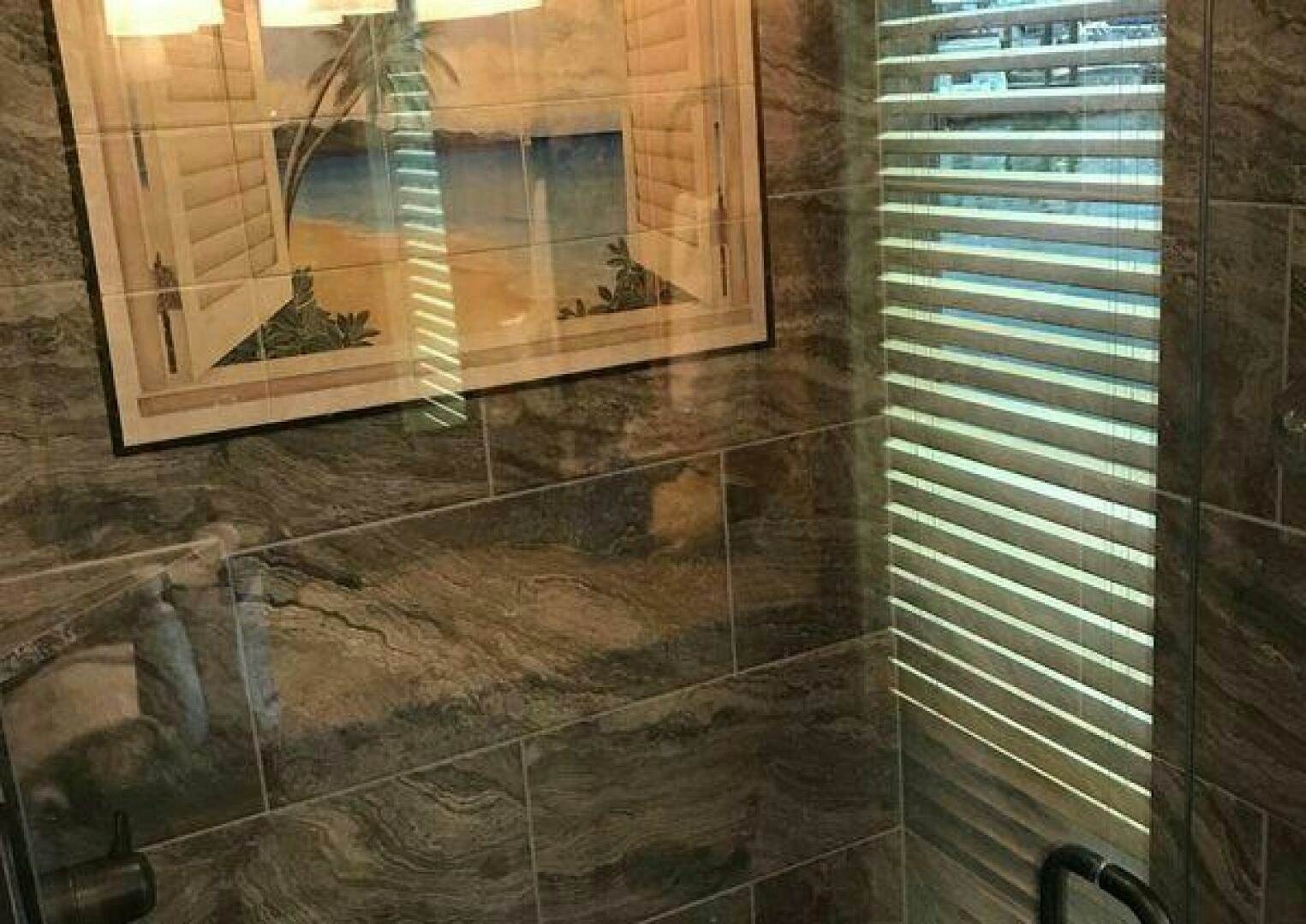 a bathroom with a glass shower aboard ST. SOMEWHERE Yacht for Sale