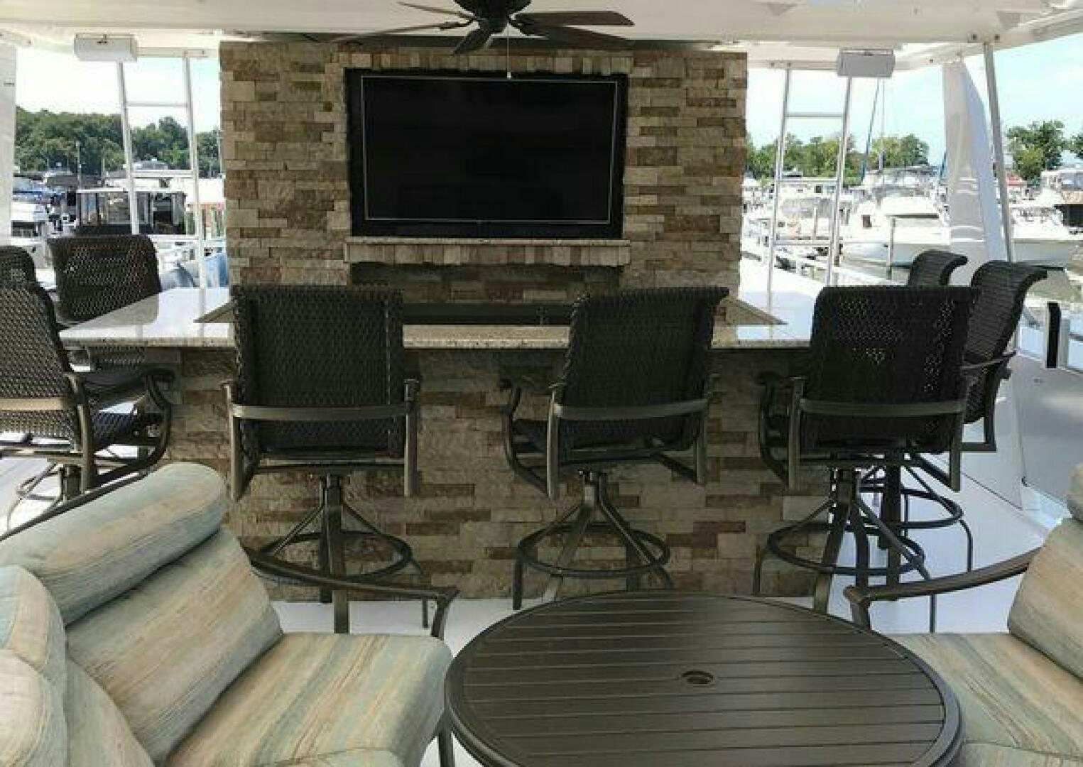 a living room with a fireplace aboard ST. SOMEWHERE Yacht for Sale