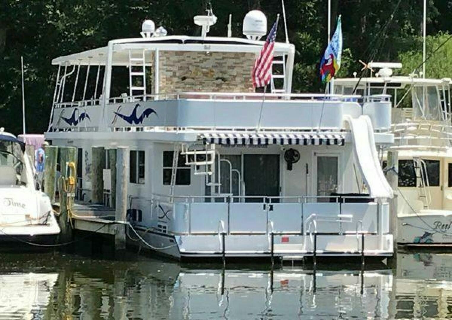 a boat docked at a pier aboard ST. SOMEWHERE Yacht for Sale