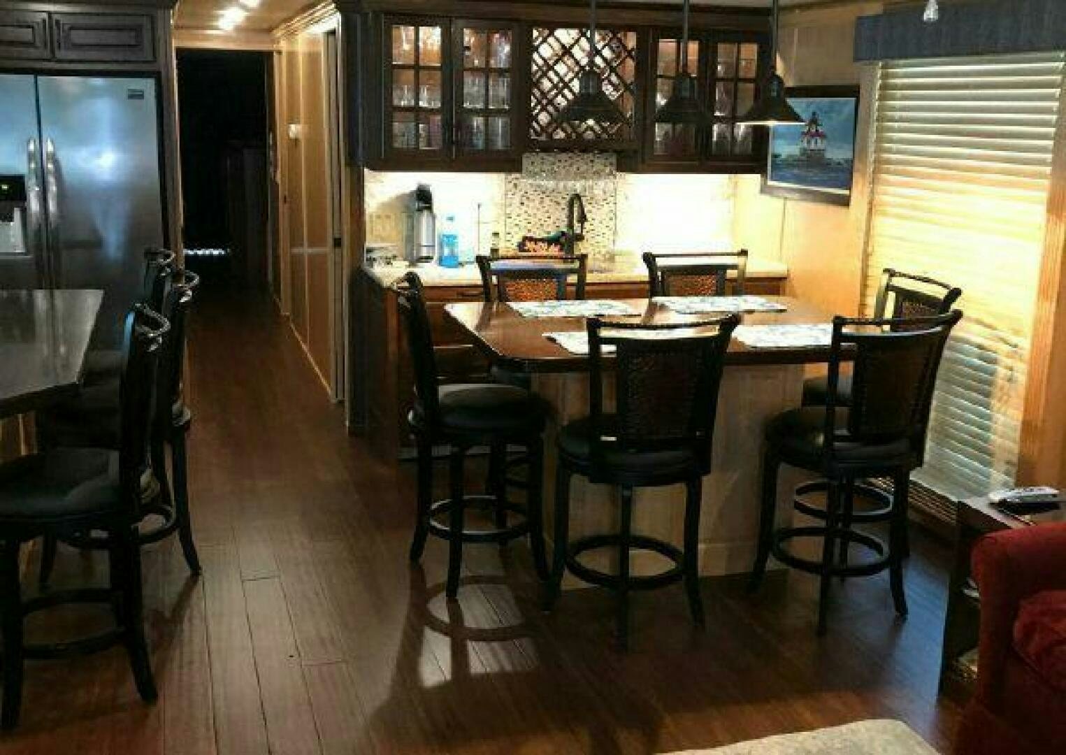 a kitchen with a table and chairs aboard ST. SOMEWHERE Yacht for Sale