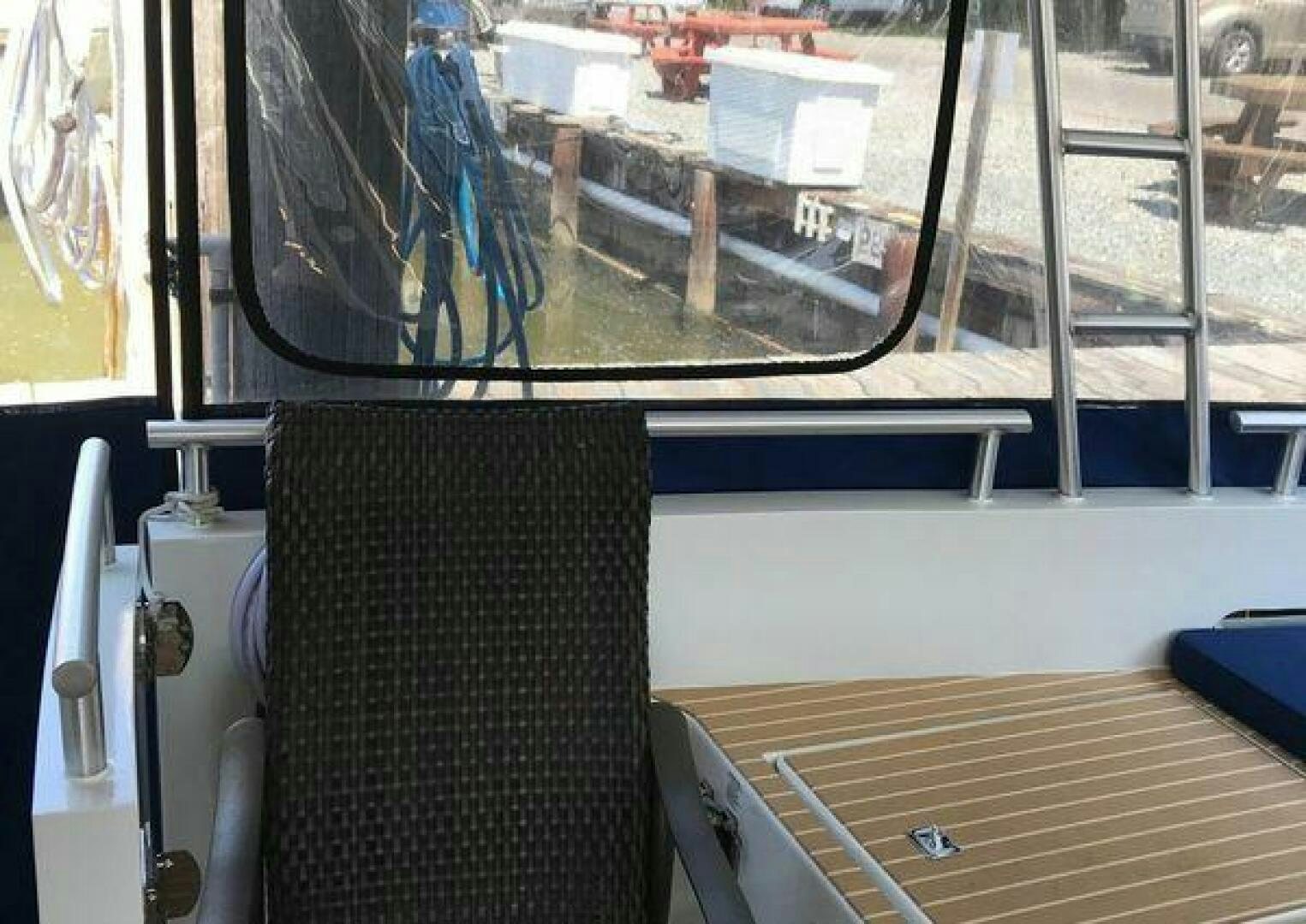 a chair in a room aboard ST. SOMEWHERE Yacht for Sale