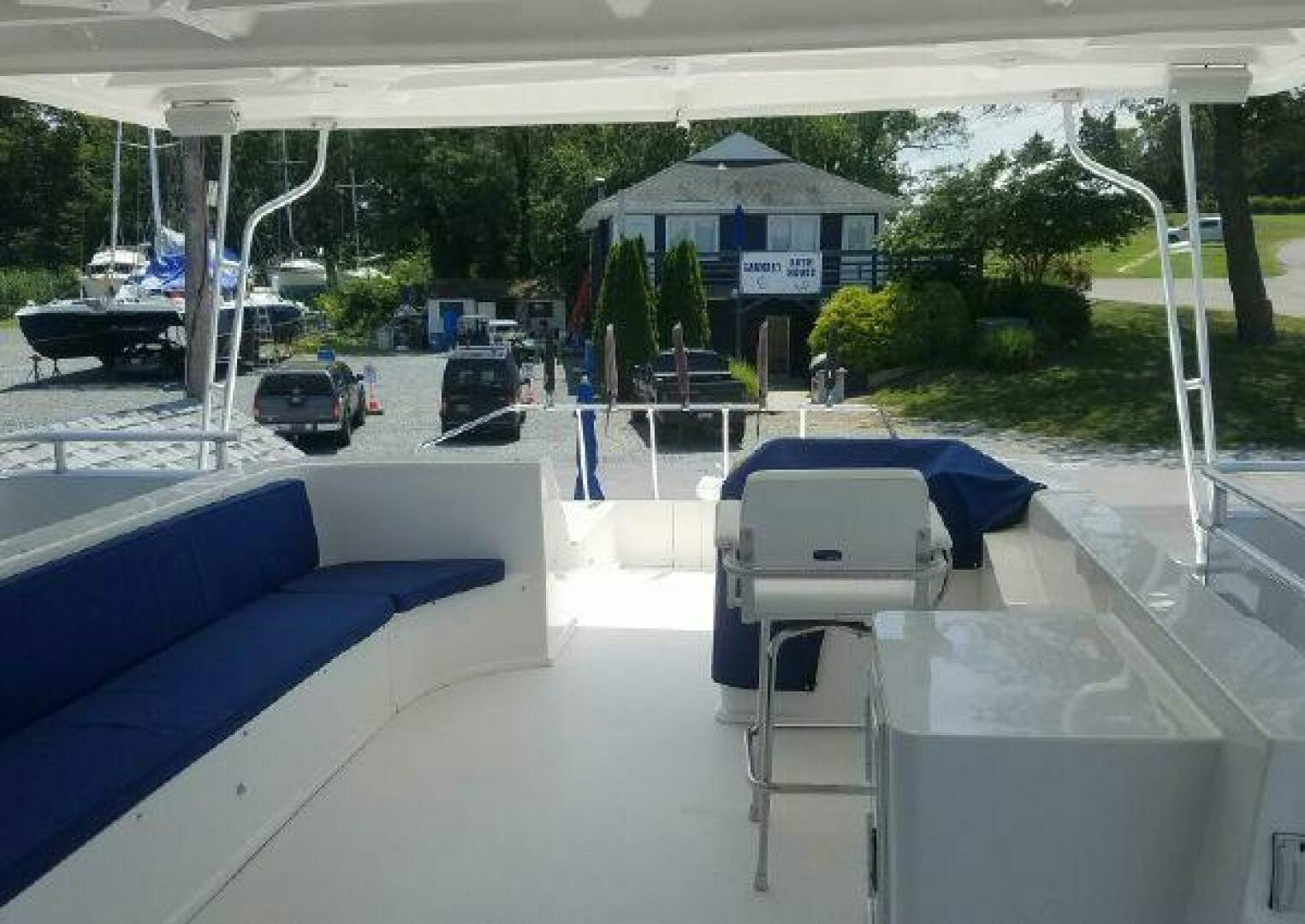 a pool with a table and chairs aboard ST. SOMEWHERE Yacht for Sale