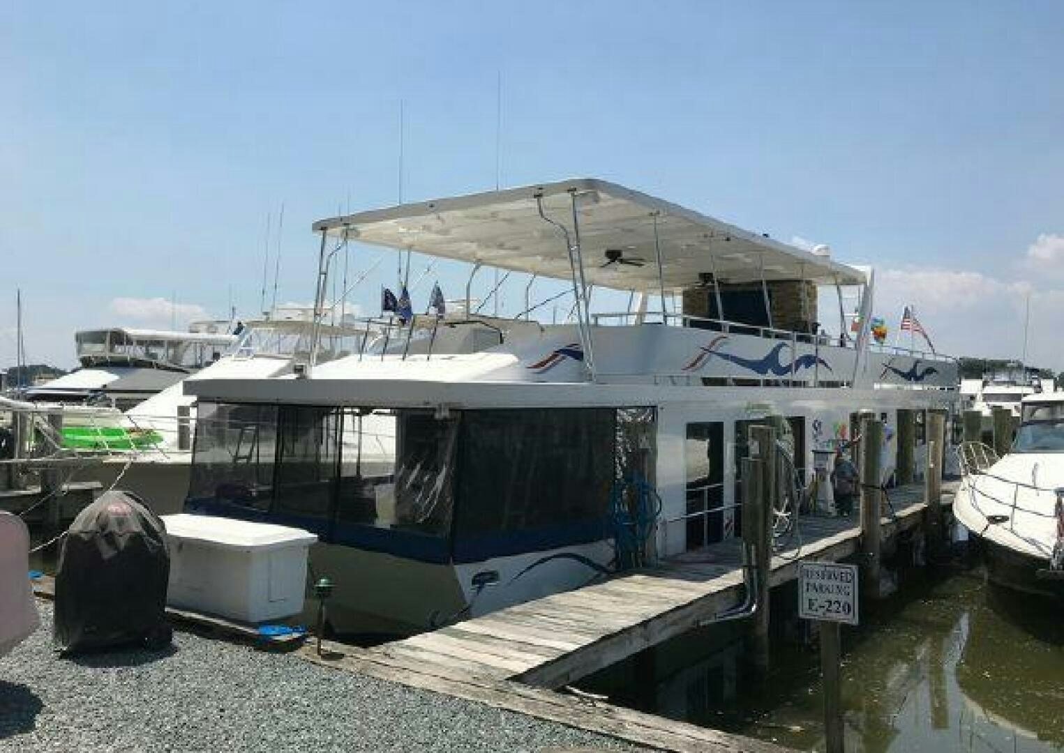 a boat docked at a pier aboard ST. SOMEWHERE Yacht for Sale