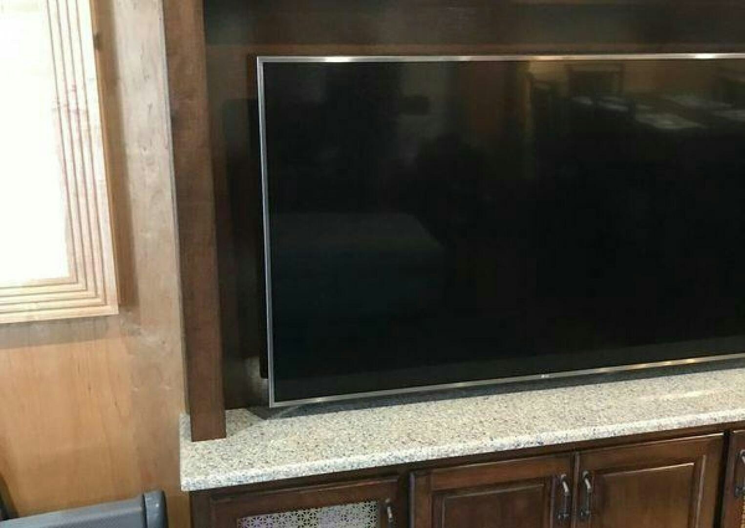 a tv on a wall aboard ST. SOMEWHERE Yacht for Sale