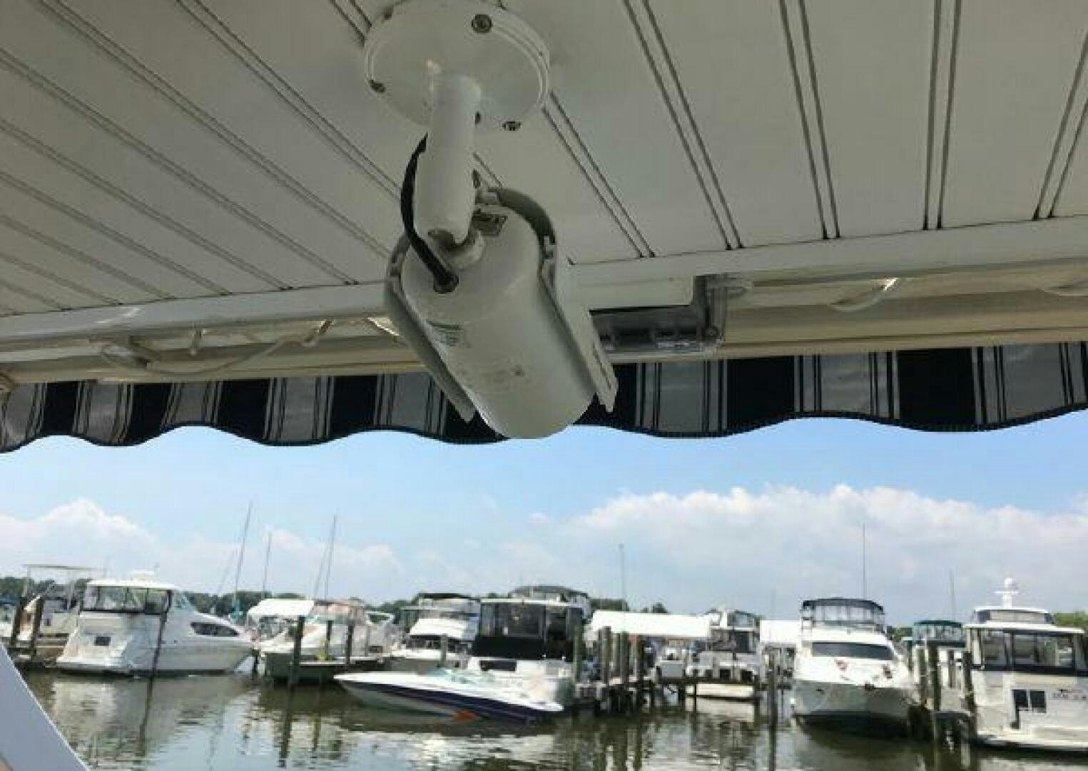 a group of boats are parked under a covered bridge aboard ST. SOMEWHERE Yacht for Sale