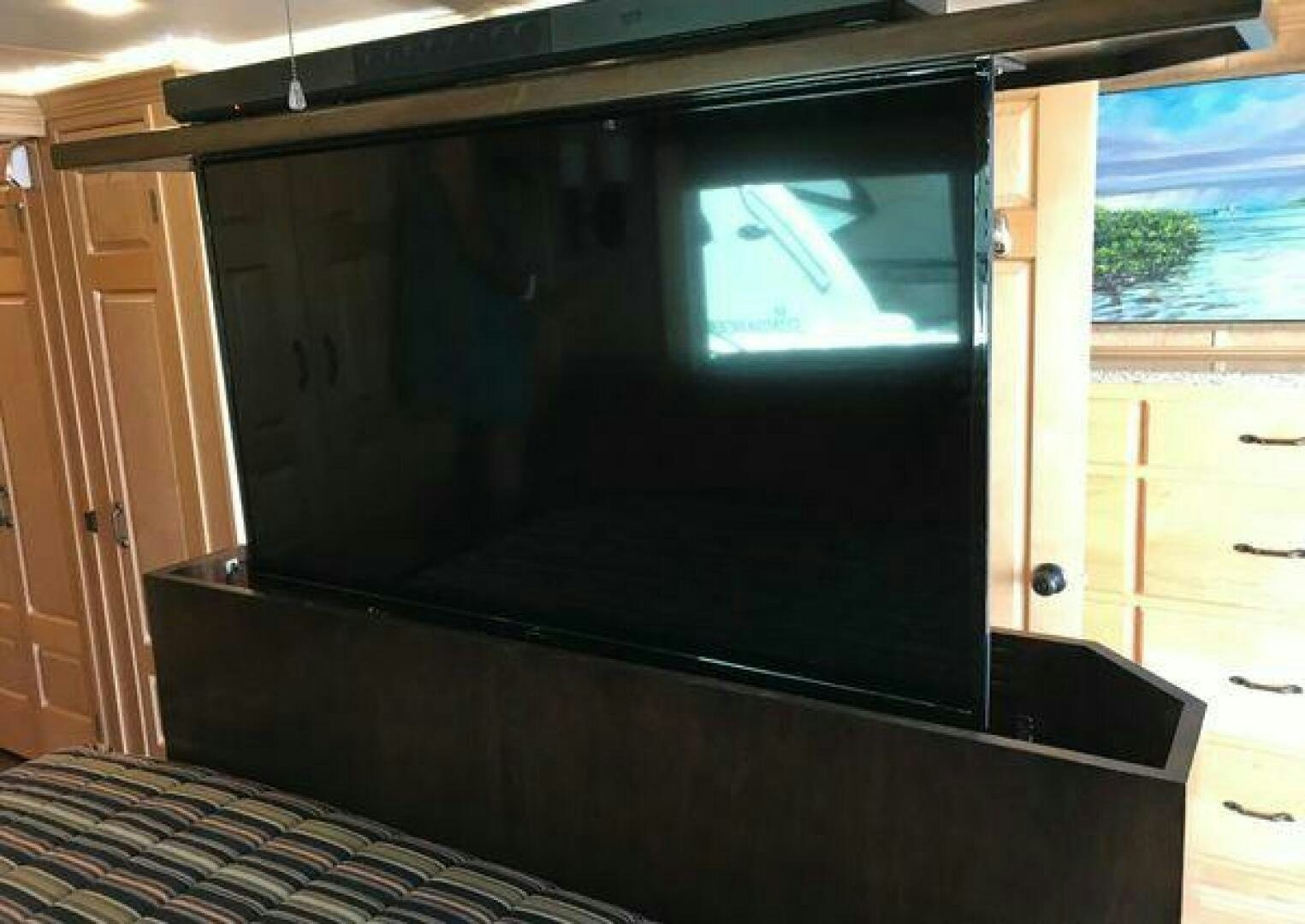 a tv on a cabinet aboard ST. SOMEWHERE Yacht for Sale
